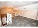 Loft bedroom with carpet and a view of the kitchen at 1032 Old Charlotte Rd, Concord, NC 28027