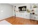 Living area with built-in shelving and hardwood floors at 12202 Shiro Ct, Huntersville, NC 28078