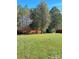 Large backyard with a shed and wooden privacy fence at 133 Elmwood Rd, Statesville, NC 28625
