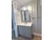 Clean bathroom with gray vanity and a tile mosaic accent wall at 133 Elmwood Rd, Statesville, NC 28625