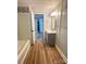 Modern bathroom with gray vanity, tile accents, and a bathtub at 133 Elmwood Rd, Statesville, NC 28625