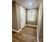 Bright bedroom with a window and wood-look flooring at 133 Elmwood Rd, Statesville, NC 28625