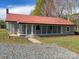 House exterior featuring a red metal roof and screened porch at 133 Elmwood Rd, Statesville, NC 28625