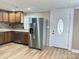 Modern kitchen with wood cabinets, tile backsplash, and stainless steel appliances at 133 Elmwood Rd, Statesville, NC 28625