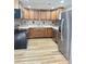 Modern kitchen with wood cabinets, tile backsplash, and stainless appliances at 133 Elmwood Rd, Statesville, NC 28625