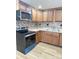 Modern kitchen with wood cabinets and tile backsplash at 133 Elmwood Rd, Statesville, NC 28625