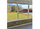 View from screened porch showcasing backyard and storage shed at 133 Elmwood Rd, Statesville, NC 28625