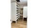 Storage room with built-in shelving and wood-look flooring at 133 Elmwood Rd, Statesville, NC 28625