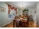 Formal dining room with hardwood floors and a wooden table at 1335 Huckleberry Dr, Lincolnton, NC 28092