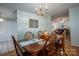 Bright dining room featuring hardwood floors and a chandelier at 1335 Huckleberry Dr, Lincolnton, NC 28092