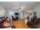Spacious living room featuring hardwood floors, a fireplace, and ample natural light at 1335 Huckleberry Dr, Lincolnton, NC 28092