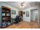 Home office with built-in shelving and hardwood floors at 1335 Huckleberry Dr, Lincolnton, NC 28092