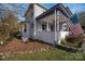 House exterior with porch, landscaping, and American flag at 203 E Congress St, Lincolnton, NC 28092