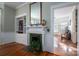 Fireplace with green tiles and built-in shelving at 203 E Congress St, Lincolnton, NC 28092