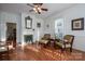 Living room with hardwood floors, fireplace, and built-in shelving at 203 E Congress St, Lincolnton, NC 28092