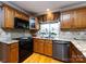 Kitchen with granite countertops, wood cabinets, and stainless steel appliances at 3534 Nestling Ln, Fort Mill, SC 29708