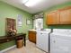 Laundry room with washer, dryer, and cabinets at 3534 Nestling Ln, Fort Mill, SC 29708