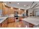 Granite countertops and wood cabinets in a modern kitchen at 4335 Laurel Hill Ln, Charlotte, NC 28217