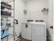 Laundry room with washer, dryer, and shelving at 7019 Branch Fork Rd, Charlotte, NC 28215