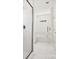 Bathroom with glass shower and marble tile at 1050 Bull Dog Ln, Wingate, NC 28174