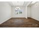 Bright dining room with hardwood floors and a modern chandelier at 1050 Bull Dog Ln, Wingate, NC 28174