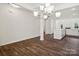 Open concept dining room with kitchen views and hardwood floors at 1050 Bull Dog Ln, Wingate, NC 28174
