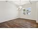 Bright dining room with hardwood floors and a modern chandelier at 1050 Bull Dog Ln, Wingate, NC 28174