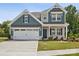 Two-story house with gray siding, white trim, and a two-car garage at 1050 Bull Dog Ln, Wingate, NC 28174