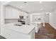 Modern kitchen with white cabinets, stainless steel appliances and an island at 1050 Bull Dog Ln, Wingate, NC 28174