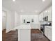 Modern kitchen with white cabinets, quartz countertops, and stainless steel appliances at 1050 Bull Dog Ln, Wingate, NC 28174