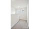 Bright loft area with neutral carpet and two windows at 1050 Bull Dog Ln, Wingate, NC 28174
