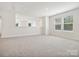 Spacious loft bedroom with carpet and two windows at 1050 Bull Dog Ln, Wingate, NC 28174