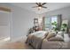 Well-lit bedroom with a queen-size bed and workspace at 10957 Sparkle Creek Dr # 138, Midland, NC 28107