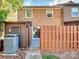 Back exterior of home with private patio and wooden fence at 1525 Lansdale Dr # F, Charlotte, NC 28205