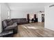 Living room with sectional sofa and hardwood floors at 1525 Lansdale Dr # F, Charlotte, NC 28205