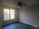 Well-lit bedroom with hardwood floors and ceiling fan at 2668 Polo Ln, Maiden, NC 28650