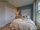 Cozy bedroom with unique headboard and natural light at 277 Hamptons Cove Rd, Troutman, NC 28166