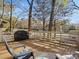 Relaxing deck overlooking wooded area with grill and seating at 294 Carroll Cv, Clover, SC 29710