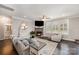 Spacious living room featuring a stone fireplace and built-in shelving at 3030 Stephen Pace Trl, Huntersville, NC 28078