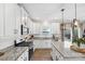 Modern kitchen with white cabinets, granite countertops and stainless steel appliances at 3425 Allenby Pl, Monroe, NC 28110