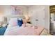 Serene bedroom featuring a pink and navy color scheme, and double doors to closet at 357 Jetton St, Davidson, NC 28036