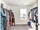 Spacious walk-in closet with ample shelving and hanging space at 4021 Eckels Dr, Charlotte, NC 28215