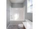 Clean bathroom with tub shower combination and gray flooring at 5136 Wheat Sw Dr, Concord, NC 28027