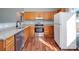 Kitchen boasts wood cabinets, granite countertops and stainless steel appliances at 5136 Wheat Sw Dr, Concord, NC 28027