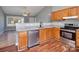 Open concept kitchen with granite countertops, stainless steel appliances and wood cabinets at 5136 Wheat Sw Dr, Concord, NC 28027