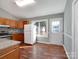 Kitchen with wood cabinets, granite countertops, and stainless steel appliances at 5136 Wheat Sw Dr, Concord, NC 28027