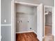 Laundry closet with shelving and space for a washer and dryer at 5136 Wheat Sw Dr, Concord, NC 28027