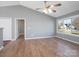 Spacious living room with hardwood floors, neutral walls, and a view of the street at 5136 Wheat Sw Dr, Concord, NC 28027
