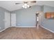 Living room with hardwood floors, neutral walls, and access to other rooms at 5136 Wheat Sw Dr, Concord, NC 28027