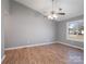 Bright living room with vaulted ceiling, ceiling fan, and laminate flooring at 5136 Wheat Sw Dr, Concord, NC 28027